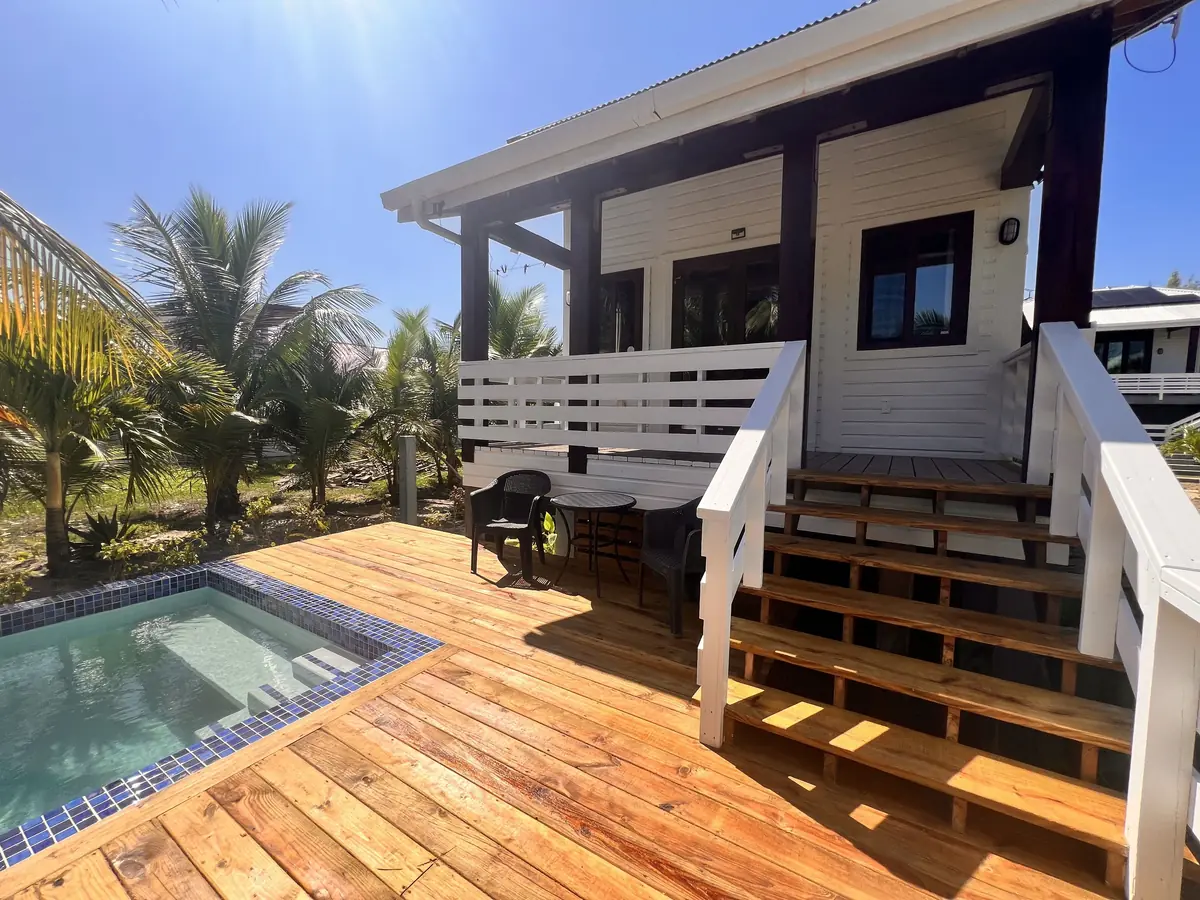 Wooden stairs up to the Casita, beside its deck and pool