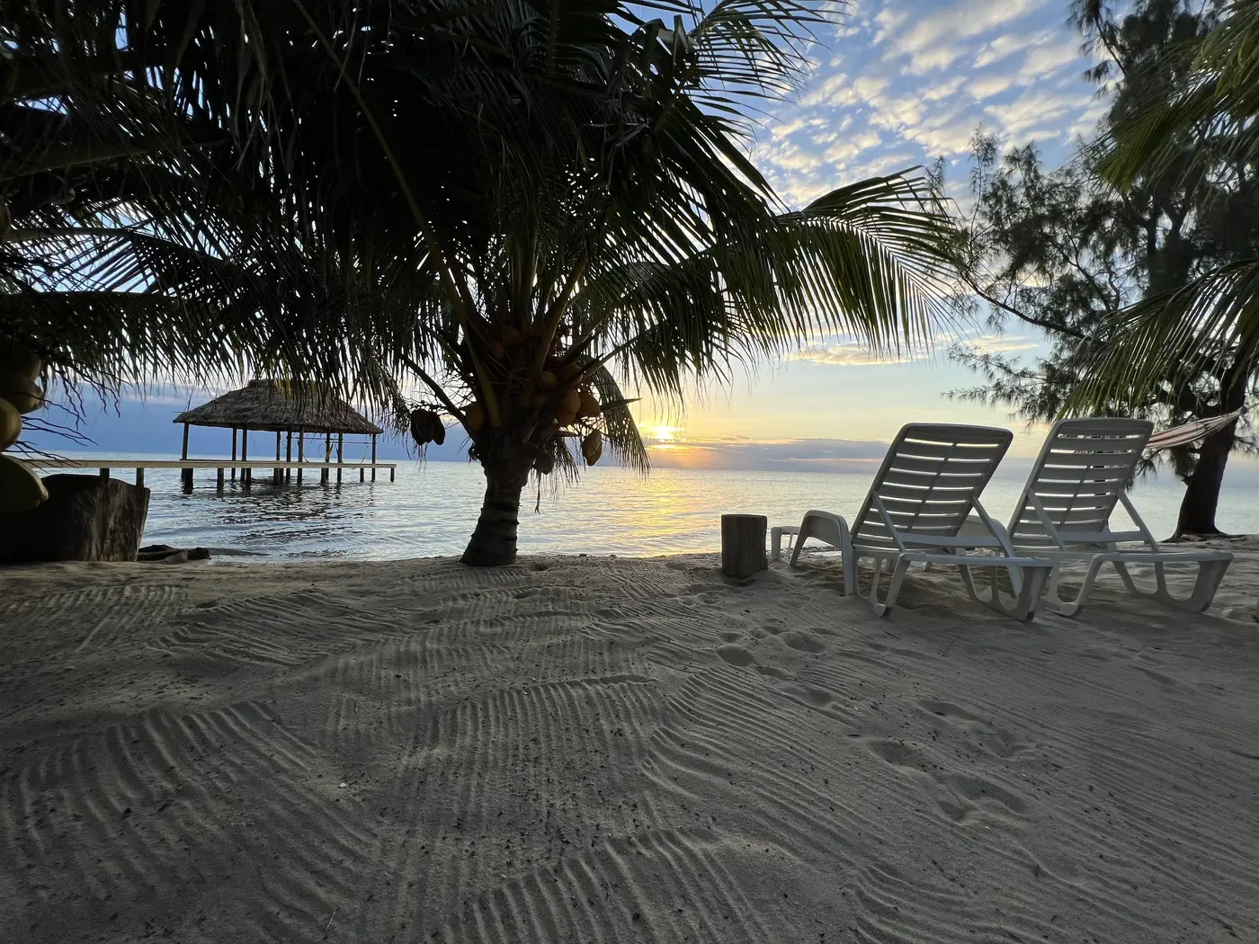 Lounge chairs on the peninsula beach in evening light