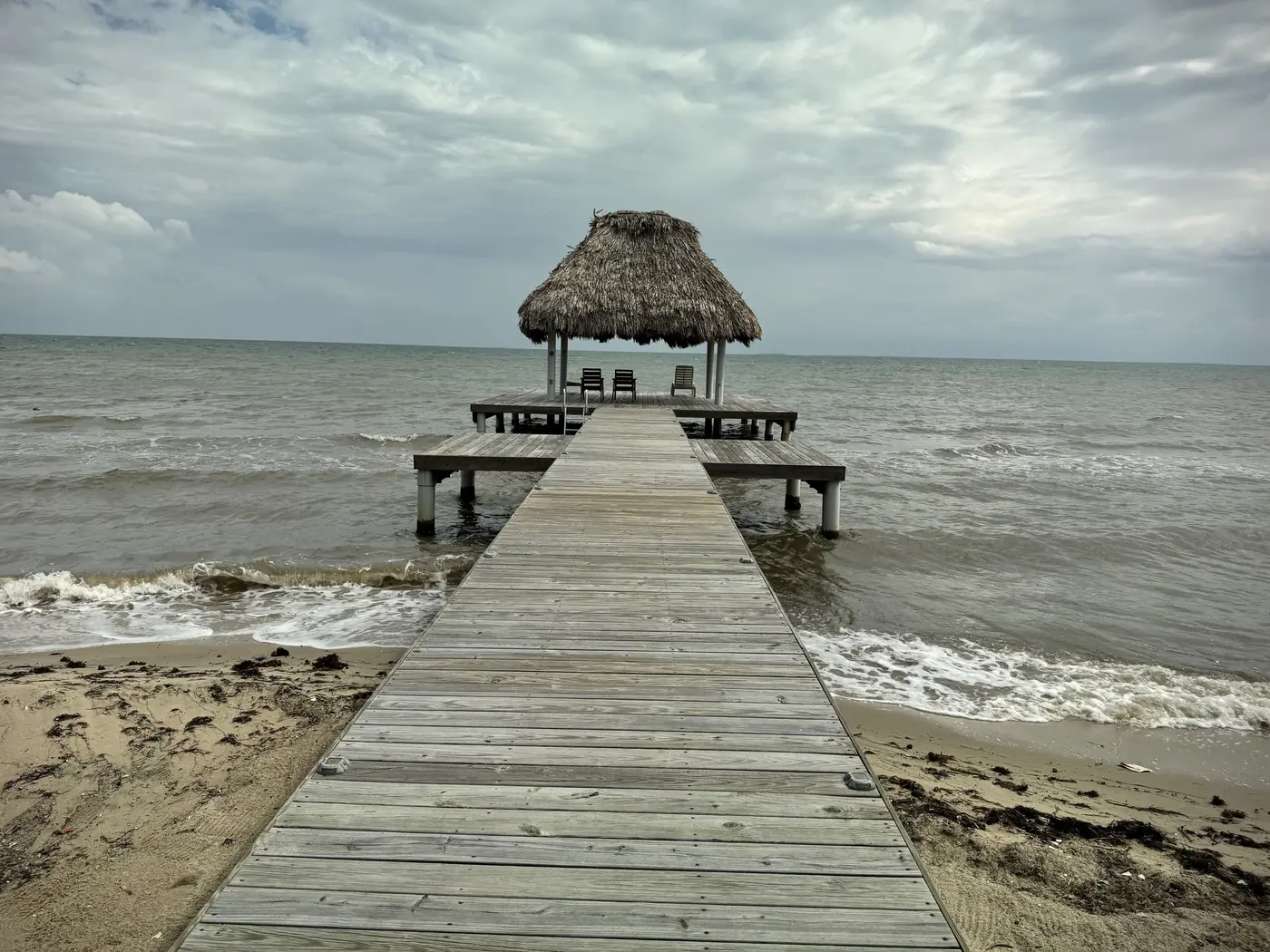 The pier leading to La Vida’s palapa over the Caribbean