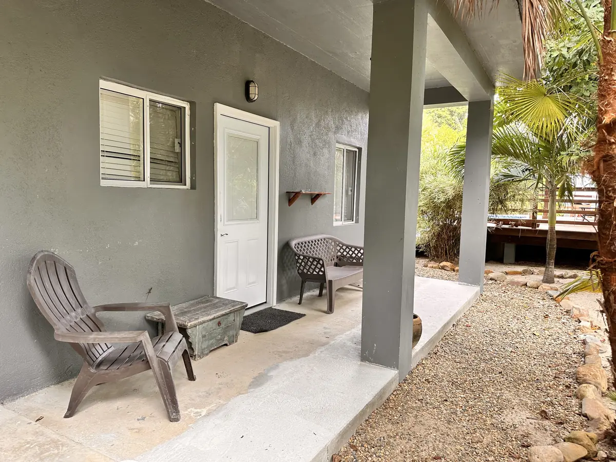 Studio entry porch with two chairs by the door